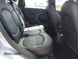 2013 MINI Countryman S z VIN WMWZC3C50DWP21636, wystawiony jako IAAI lot #42113244 z przebiegiem 85 344 mil mil oraz . Historia ofert i sprzedaży dostępna na DreamBid. Obrazek 8.