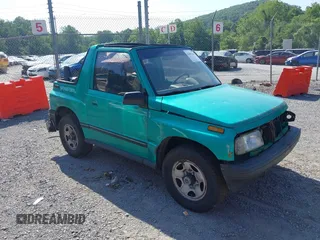 1995 Chevrolet Tracker z VIN 2CNBJ1865S6924234, wystawiony jako IAAI lot #42493263 z przebiegiem 158 552 mil mil oraz . Historia ofert i sprzedaży dostępna na DreamBid. Obrazek 1.