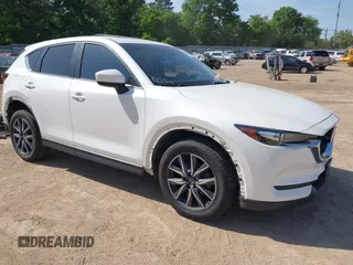 2018 Mazda CX-5 Touring z VIN JM3KFACMXJ1379538, wystawiony jako IAAI lot #42030714 z przebiegiem 77 728 mil mil oraz . Historia ofert i sprzedaży dostępna na DreamBid. Obrazek 1.