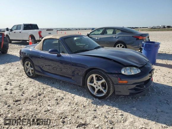 2002 Mazda MX-5 Miata Cloth z VIN JM1NB353720231873, wystawiony jako Copart lot #52398015 z przebiegiem 90 077 mil mil oraz Szkoda całkowita • Salvage title. Historia ofert i sprzedaży dostępna na DreamBid. Obrazek 4.