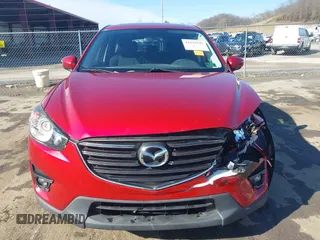 2016 Mazda CX-5 Touring with VIN JM3KE4CY4G0860035, listed as a IAAI auction lot 41678299 with 72,101 mi miles. Bid and sale history available at carsss.com. Image 12.