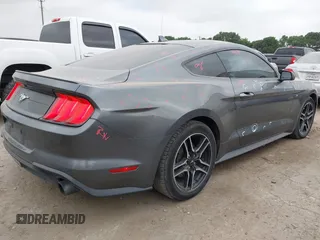 2021 Ford Mustang EcoBoost with VIN 1FA6P8TH0M5115864, listed as a IAAI auction lot 42287791 with 94,842 mi miles and . Bid and sale history available at DreamBid. Image 4.