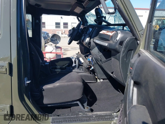 2015 Jeep Wrangler Unlimited Rubicon with VIN 1C4BJWFG0FL623431, listed as a IAAI auction lot 41651317 with 105,508 mi miles. Bid and sale history available at carsss.com. Image 5.