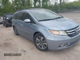 2014 Honda Odyssey Touring with VIN 5FNRL5H91EB081811, listed as a IAAI auction lot 42153920 with 16 mi miles and . Bid and sale history available at DreamBid. Image 1.