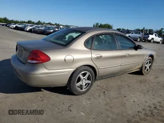 2004 Ford Taurus SE z VIN 1FAFP53284A156633, wystawiony jako Copart lot #58164985 z przebiegiem 91 246 mil mil oraz Szkoda całkowita • Salvage title. Historia ofert i sprzedaży dostępna na DreamBid. Obrazek 3.