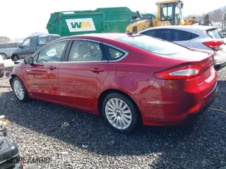 2014 Ford Fusion SE Hybrid with VIN 3FA6P0LU0ER385982, listed as a IAAI auction lot 41804715 with 110,590 mi miles. Bid and sale history available at carsss.com. Image 3.