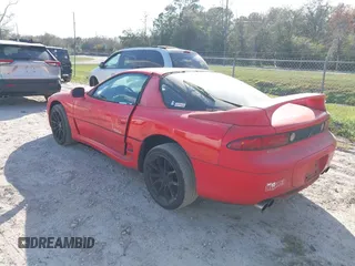 1999 Mitsubishi 3000GT z VIN JA3AM44H1XY003323, wystawiony jako IAAI lot #41560169 z przebiegiem 154 597 mil mil oraz . Historia ofert i sprzedaży dostępna na DreamBid. Obrazek 3.