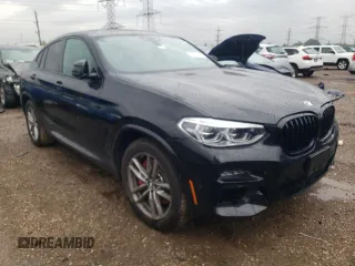 2021 BMW X4 M40i with VIN 5UX2V5C00M9H95699, listed as a Copart auction lot 63564433 with 33,500 mi miles and Salvage title. Bid and sale history available at DreamBid. Image 4.