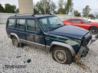 1996 Jeep Cherokee Country with VIN 1J4FJ78S7TL242853, listed as a Copart auction lot 73022554 with 84,868 mi miles and Salvage Title. Bid and sale history available at carsss.com. Image 4.