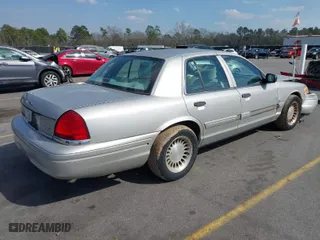 2004 Ford Crown Victoria Standard with VIN 2FAFP73W94X107561, listed as a IAAI auction lot 41804985 with 128,066 mi miles. Bid and sale history available at carsss.com. Image 4.
