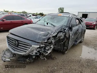 2018 Mazda CX-9 Grand Touring z VIN JM3TCADY2J0208464, wystawiony jako Copart lot #55214645 z przebiegiem Nie podano mil oraz Szkoda całkowita • Salvage title. Historia ofert i sprzedaży dostępna na DreamBid. Obrazek 1.
