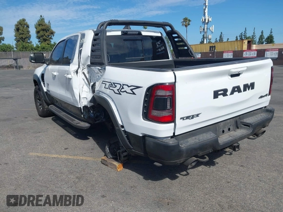 2021 Ram 1500 TRX with VIN 1C6SRFU9XMN905260, listed as a IAAI auction lot 41745910 with 69,565 mi miles and . Bid and sale history available at DreamBid. Image 3.