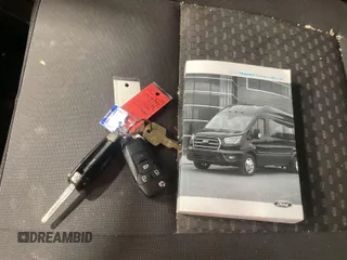 2020 Ford Transit Cargo with VIN 1FTBR1CG6LKB75357, listed as a IAAI auction lot 42243287 with 100,958 mi miles and . Bid and sale history available at DreamBid. Image 32.