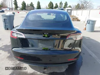 2019 Tesla Model 3 Mid Range with VIN 5YJ3E1EA2KF305834, listed as a IAAI auction lot 41719610 with 126,333 mi miles and . Bid and sale history available at DreamBid. Image 16.