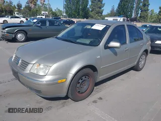 2004 Volkswagen Jetta GL z VIN 3VWRA69M64M039222, wystawiony jako IAAI lot #42262445 z przebiegiem 100 200 mil mil oraz . Historia ofert i sprzedaży dostępna na DreamBid. Obrazek 2.