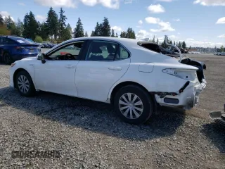 2021 Toyota Camry Hybrid LE with VIN 4T1C31AK0MU563909, listed as a Copart auction lot 55063965 with 26,802 mi miles and Salvage Title. Bid and sale history available at carsss.com. Image 2.