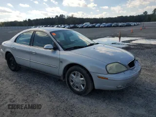 2003 Mercury Sable LS with VIN 1MEHM55S73A619013, listed as a Copart auction lot 73504154 with 200,135 mi miles and Salvage Title. Bid and sale history available at DreamBid. Image 4.