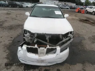 2006 Nissan Sentra S z VIN 3N1CB51D06L503631, wystawiony jako IAAI lot #42411629 z przebiegiem 198 884 mil mil oraz . Historia ofert i sprzedaży dostępna na DreamBid. Obrazek 13.