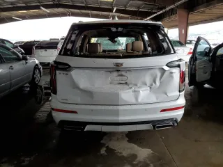 2021 Cadillac XT6 AWD Sport z VIN 1GYKPHRSXMZ195978, wystawiony jako Copart lot #80886314 z przebiegiem Nie podano mil oraz Szkoda całkowita • Salvage title. Historia ofert i sprzedaży dostępna na DreamBid. Obrazek 6.