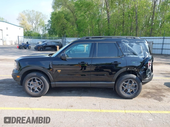 2022 Ford Bronco Sport Badlands z VIN 3FMCR9D95NRD81024, wystawiony jako IAAI lot #42255256 z przebiegiem 15 234 mil mil oraz . Historia ofert i sprzedaży dostępna na DreamBid. Obrazek 14.