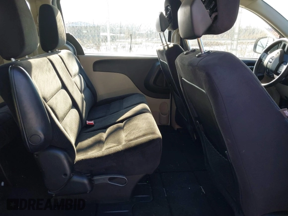 2014 Dodge Grand Caravan American Value with VIN 2C4RDGBG7ER422178, listed as a IAAI auction lot 41352312 with 176,415 mi miles and . Bid and sale history available at DreamBid. Image 8.