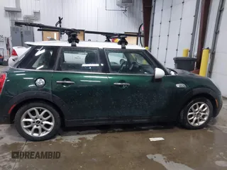2015 MINI Hardtop 4 Door S z VIN WMWXU3C55FT892293, wystawiony jako IAAI lot #41359066 z przebiegiem 112 704 mil mil oraz . Historia ofert i sprzedaży dostępna na DreamBid. Obrazek 13.