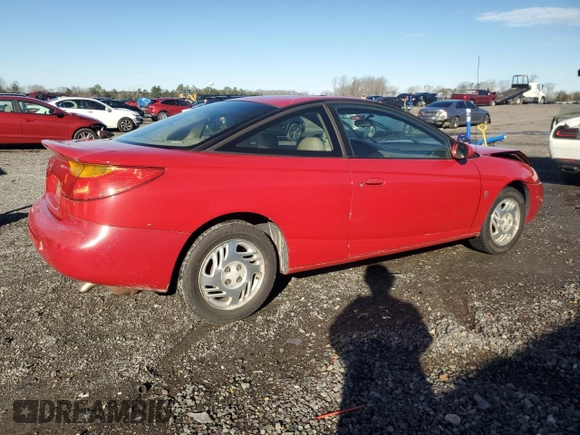 2001 Saturn SC z VIN 1G8ZY12751Z284992, wystawiony jako Copart lot #87116694 z przebiegiem 134 690 mil mil oraz Tytuł czysty. Historia ofert i sprzedaży dostępna na DreamBid. Obrazek 3.