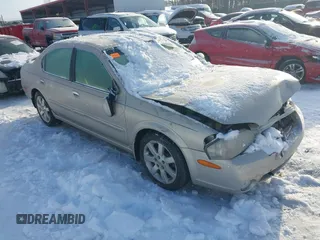2002 Nissan Maxima GLE z VIN JN1DA31D62T437944, wystawiony jako IAAI lot #41278832 z przebiegiem 140 412 mil mil oraz . Historia ofert i sprzedaży dostępna na DreamBid. Obrazek 1.