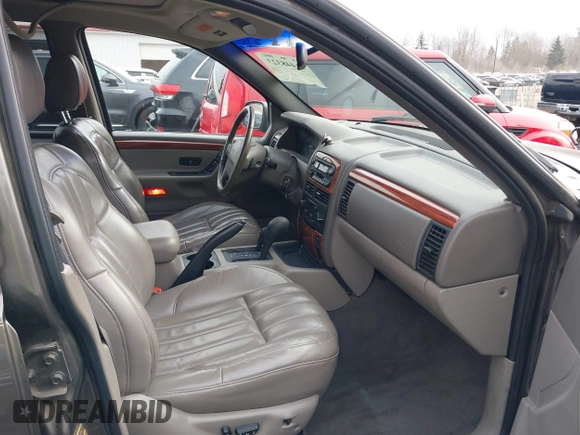 1999 Jeep Grand Cherokee Limited with VIN 1J4GW68N7XC739479, listed as a IAAI auction lot 41448323 with 129,840 mi miles. Bid and sale history available at carsss.com. Image 5.