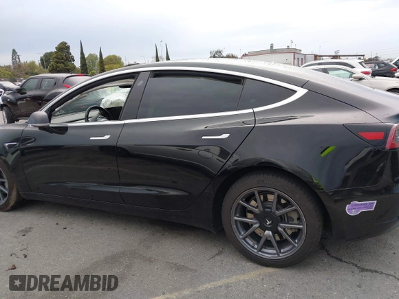 2019 Tesla Model 3 Mid Range with VIN 5YJ3E1EA6KF361808, listed as a IAAI auction lot 41767241 with 96,200 mi miles and . Bid and sale history available at carsss.com. Image 14.