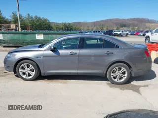 2014 Ford Taurus SEL with VIN 1FAHP2E82EG162676, listed as a IAAI auction lot 41795220 with 125,491 mi miles. Bid and sale history available at carsss.com. Image 15.