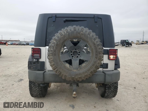 2009 Jeep Wrangler Unlimited Rubicon with VIN 1J8GA69169L731787, listed as a Copart auction lot 44604125 with 180,861 mi miles and Salvage title. Bid and sale history available at DreamBid. Image 6.