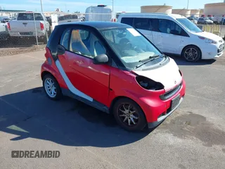 2009 Smart fortwo Pure with VIN WMEEJ31XX9K219695, listed as a IAAI auction lot 41280141 with 93,896 mi miles. Bid and sale history available at carsss.com. Image 1.