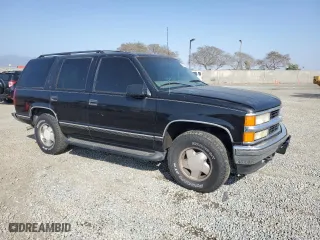 1999 Chevrolet Tahoe Z71 with VIN 1GNEK13R5XJ308924, listed as a Copart auction lot 64463984 with 229,181 mi miles and Salvage Title. Bid and sale history available at carsss.com. Image 4.