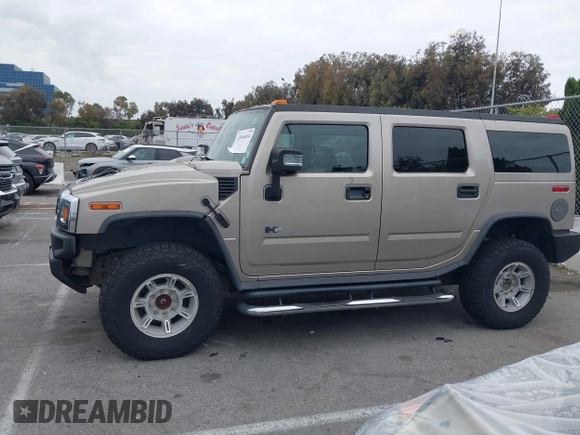 2005 Hummer H2 SUV with VIN 5GRGN23U95H129470, listed as a IAAI auction lot 42046654 with 63,489 mi miles. Bid and sale history available at carsss.com. Image 14.