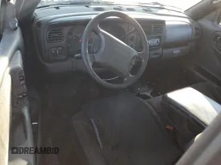 2000 Dodge Dakota z VIN 1B7FL26X5YS793314, wystawiony jako Copart lot #79477744 z przebiegiem 358 319 mil mil oraz Szkoda całkowita • Salvage title. Historia ofert i sprzedaży dostępna na DreamBid. Obrazek 8.