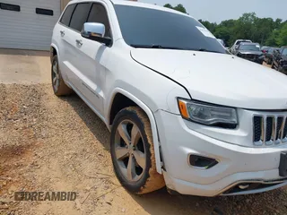 2016 Jeep Grand Cherokee Overland z VIN 1C4RJECGXGC423753, wystawiony jako IAAI lot #42393516 z przebiegiem 176 918 mil mil oraz . Historia ofert i sprzedaży dostępna na DreamBid. Obrazek 1.