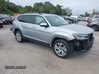 2021 Volkswagen Atlas SE z VIN 1V2JR2CA7MC556268, wystawiony jako IAAI lot #41185525 z przebiegiem 73 724 mil mil oraz . Historia ofert i sprzedaży dostępna na DreamBid. Obrazek 1.