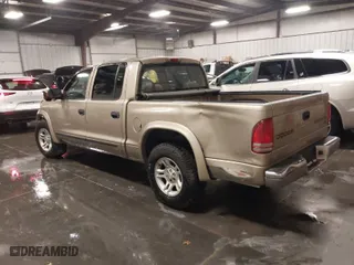 2004 Dodge Dakota SLT with VIN 1D7HL48N04S536819, listed as a IAAI auction lot 41210798 with 140,965 mi miles. Bid and sale history available at carsss.com. Image 3.