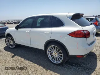 2014 Porsche Cayenne with VIN WP1AA2A28ELA09742, listed as a Copart auction lot 61779285 with 182,380 mi miles and Salvage title. Bid and sale history available at DreamBid. Image 2.