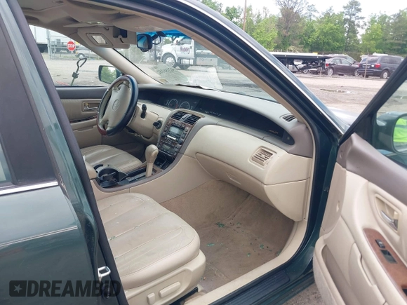 2001 Toyota Avalon XL z VIN 4T1BF28B11U168387, wystawiony jako IAAI lot #42186182 z przebiegiem 129 935 mil mil oraz . Historia ofert i sprzedaży dostępna na DreamBid. Obrazek 5.