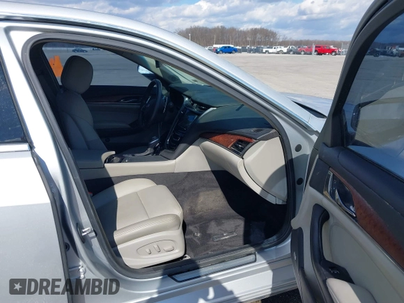 2015 Cadillac CTS RWD with VIN 1G6AP5SX5F0115745, listed as a IAAI auction lot 41658935 with 62,477 mi miles and . Bid and sale history available at DreamBid. Image 5.