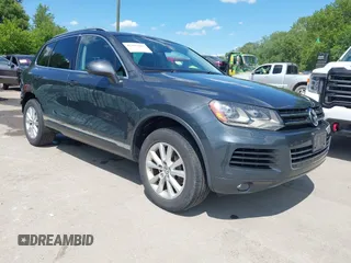 2013 Volkswagen Touareg Lux with VIN WVGEF9BP7DD005306, listed as a IAAI auction lot 42297427 with 158,899 mi miles and . Bid and sale history available at DreamBid. Image 1.