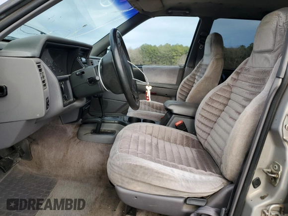 1995 Jeep Grand Cherokee Laredo with VIN 1J4GZ58S7SC517783, listed as a Copart auction lot 43057145 with 225,273 mi miles and Salvage Title. Bid and sale history available at carsss.com. Image 7.