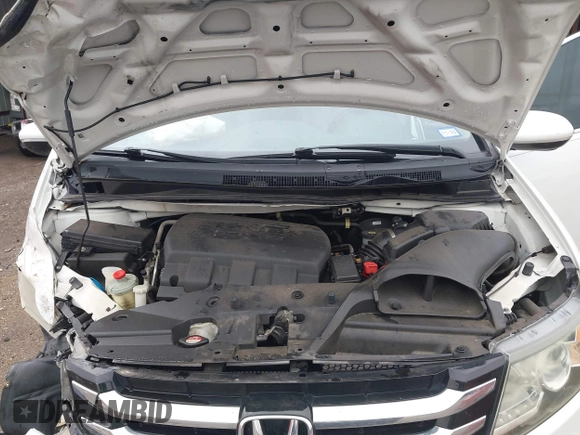 2014 Honda Odyssey Touring with VIN 5FNRL5H95EB059729, listed as a IAAI auction lot 42148110 with 135,304 mi miles and . Bid and sale history available at DreamBid. Image 10.
