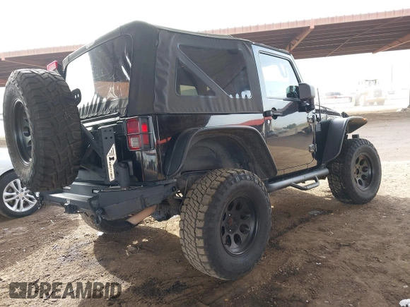 2011 Jeep Wrangler Rubicon with VIN 1J4BA6D13BL545343, listed as a IAAI auction lot 40980056 with 107,207 mi miles and . Bid and sale history available at carsss.com. Image 4.
