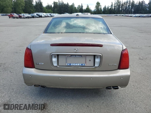 2004 Cadillac DeVille DTS z VIN 1G6KF579X4U212415, wystawiony jako Copart lot #58005555 z przebiegiem 97 663 mil mil oraz Tytuł czysty. Historia ofert i sprzedaży dostępna na DreamBid. Obrazek 6.