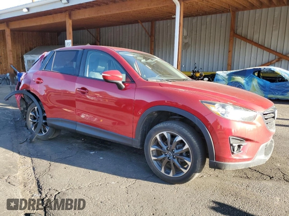 2016 Mazda CX-5 Grand Touring z VIN JM3KE4DY9G0753691, wystawiony jako Copart lot #57361645 z przebiegiem 90 733 mil mil oraz Szkoda całkowita • Salvage title. Historia ofert i sprzedaży dostępna na DreamBid. Obrazek 4.