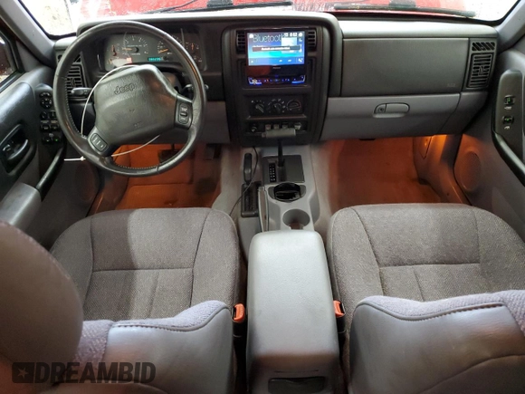 1998 Jeep Cherokee Sport with VIN 1J4FJ68S7WL148034, listed as a Copart auction lot 52436475 with 80,239 mi miles and Salvage Title. Bid and sale history available at carsss.com. Image 8.