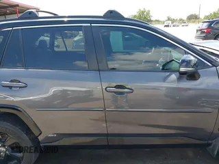 2021 Toyota RAV4 Hybrid XSE with VIN 2T3E6RFV8MW026973, listed as a IAAI auction lot 42052289 with 94,857 mi miles and . Bid and sale history available at DreamBid. Image 13.